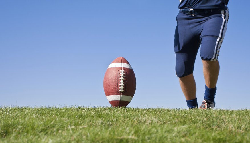 Football player about to kick ball