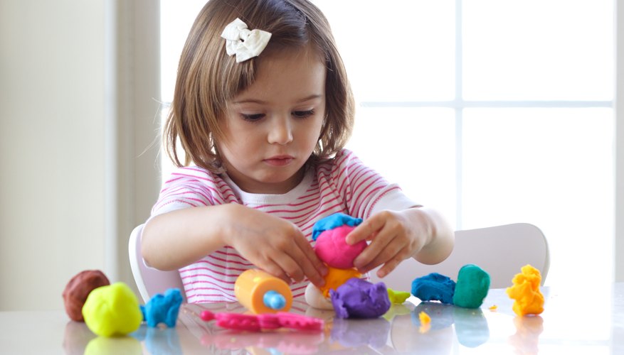 Girl playing with salt dough