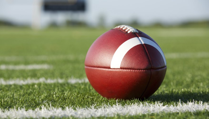 A football lying on a stadium field