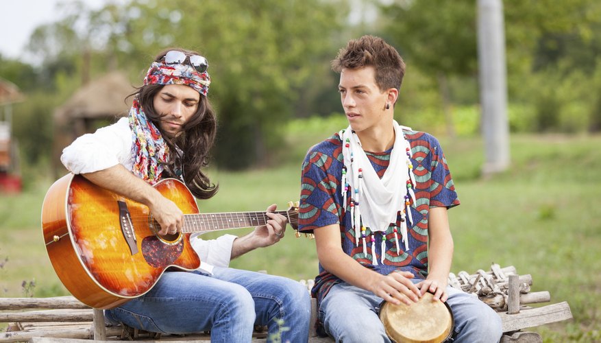 Men playing guitar and bongo drum.