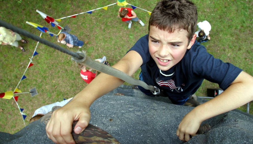 Young boy rock climbing