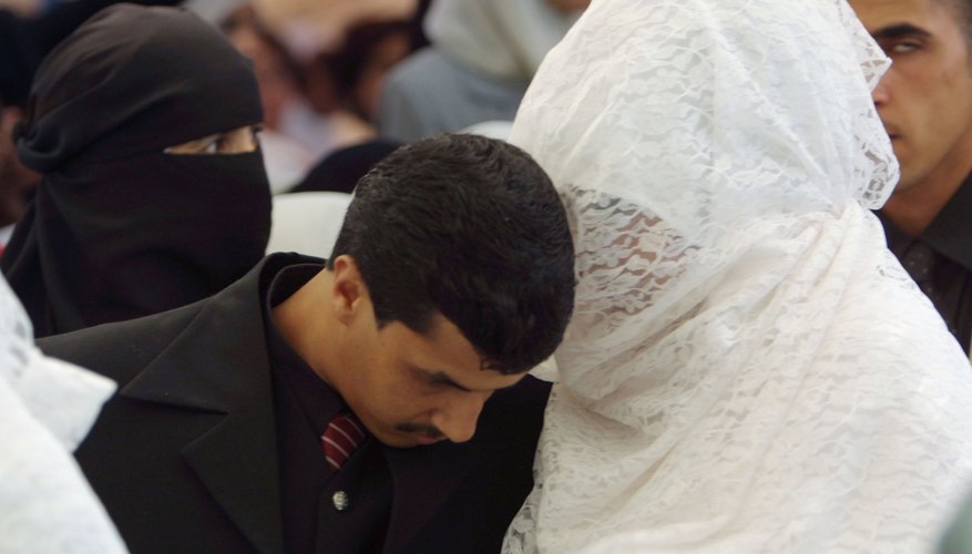 Veiled Muslim bride and groom