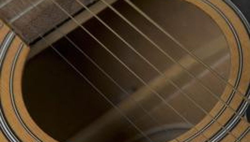 The top and bottom of a guitar are supported by bracing.