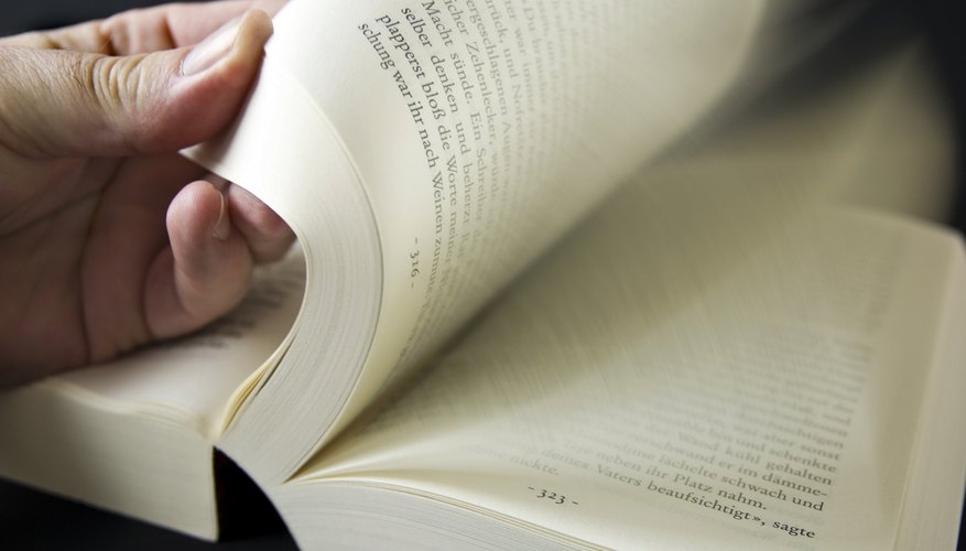 Someone is flipping through pages in a book.