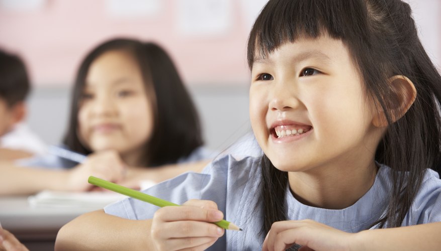 Young student smiling in classroom