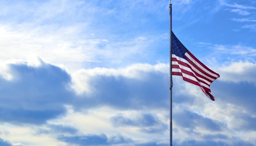 An American flag flying at half mast.