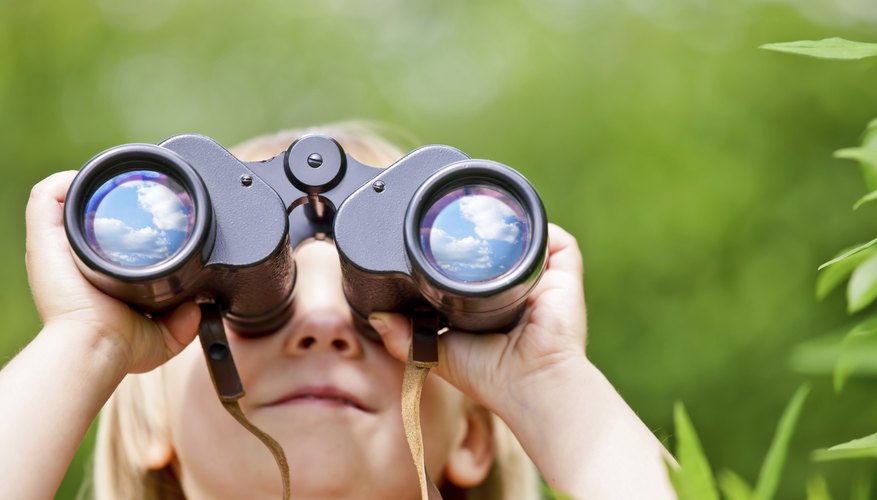 Young Girl Scout holding binoculars