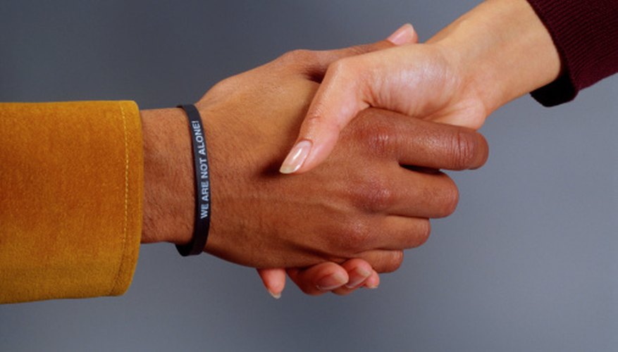 A handshake is a common and ancient method of greeting.