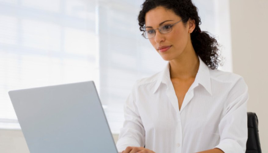 Woman typing on laptop