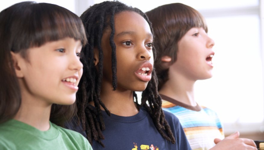 Elementary students enjoy singing together.