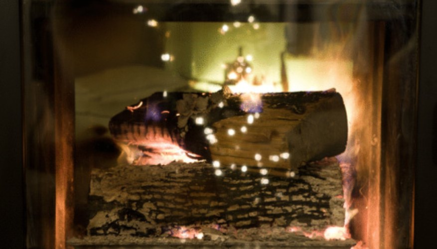 Photo Credit: Jupiterimages/Photos.com/Getty Images Embers within the fire help to extend the burn time.