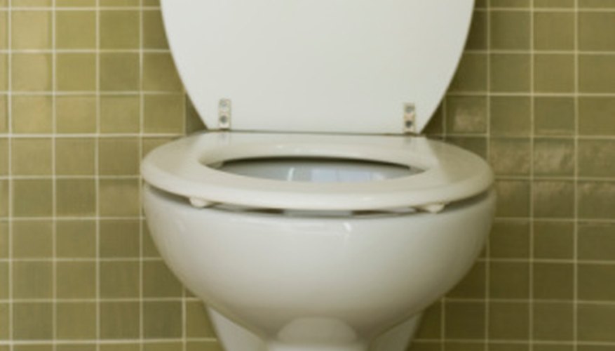 You can remove a toilet seat with stuck nuts on your own.