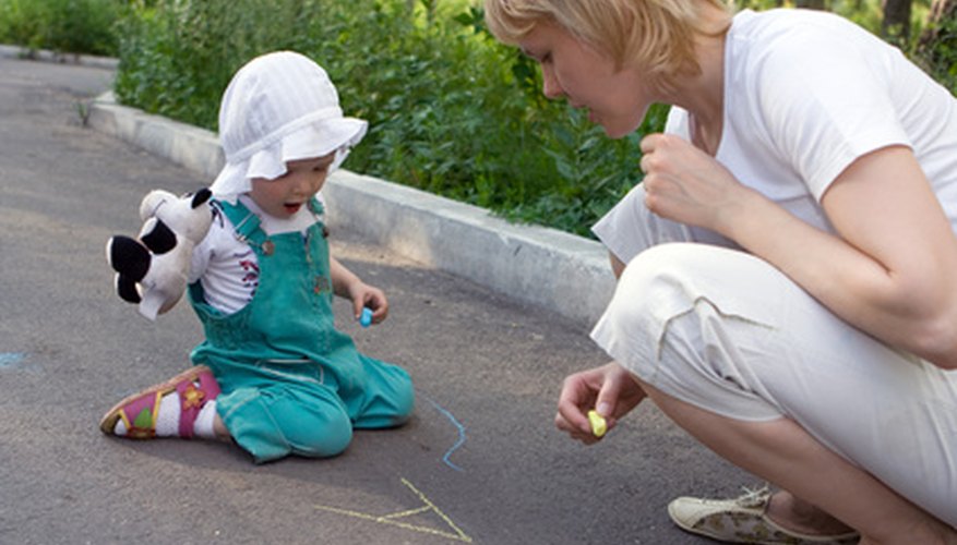 Drawing with chalk outside is a perfect activity for a spring day.