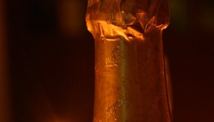 Include champagne in a romantic gift basket. Include champagne in a romantic gift basket.