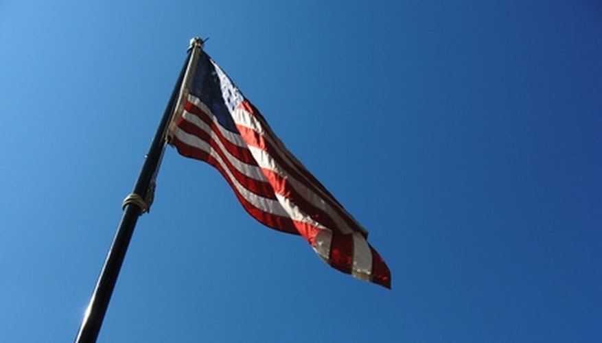 Photo Credit: Stars and stripes USA flag on a flagpole image by Steve Johnson from <a href= Climbing a flag pole to measure its height is usually not permitted.