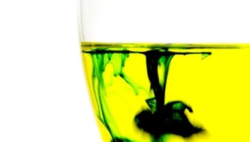 Photo Credit: chemical image by Randy McKown from <a href= Bromothymol blue indicator will turn yellow in an acidic solution.