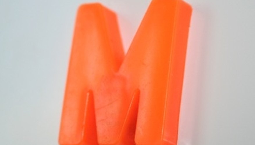 Photo Credit: magnet m image by Vita Vanaga from <a href='http://www.fotolia.com'>Fotolia.com</a> Magnets and electromagnets have a host of different uses in the modern world.