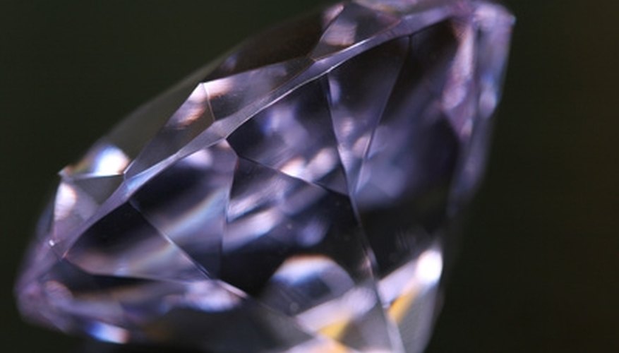 Photo Credit: diamond image by sumos from <a href='http://www.fotolia.com'>Fotolia.com</a> Specific gravity can be used to separate real from fake diamonds.