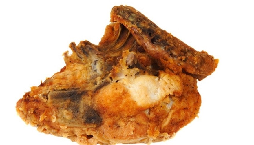 Photo Credit: fried chicken breast on a white background. image by James Insogna from <a href='http://www.fotolia.com'>Fotolia.com</a> Sterilize the chicken bones after eating and save them for future use.