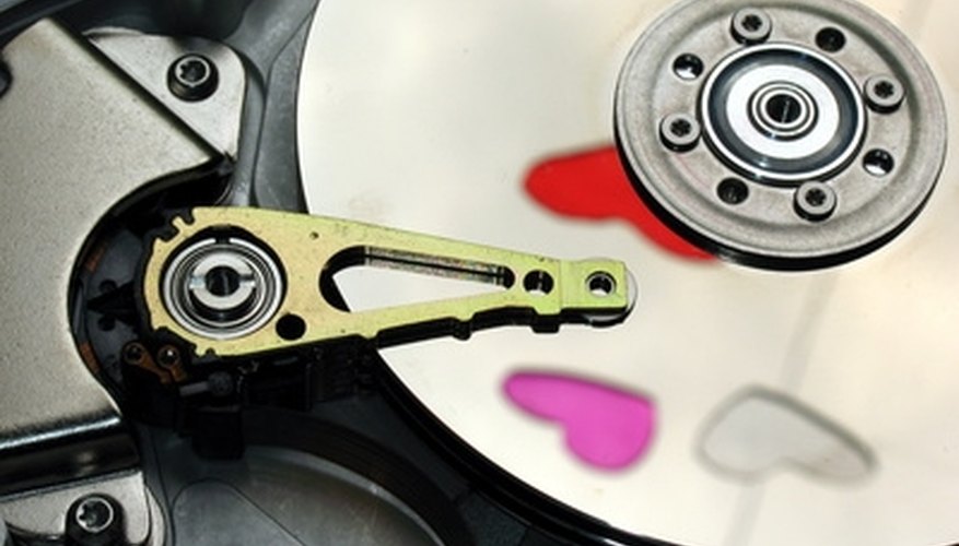 Photo Credit: hard drive image by Stanisa Martinovic from <a href='http://www.fotolia.com'>Fotolia.com</a> Neodymium magnets can be part of hard drives.