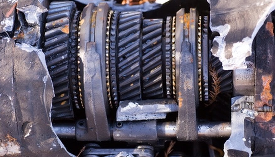 Photo Credit: old gearbox dumped in a rest area on the side of the road image by Undy from <a href='http://www.fotolia.com'>Fotolia.com</a> Calculate Stress for a Flywheel