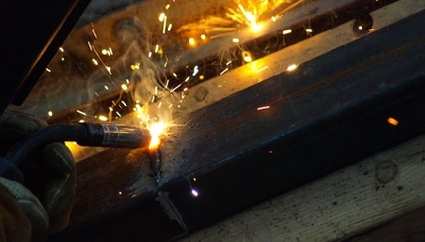 Photo Credit: Weld image by Flutterby from <a href='http://www.fotolia.com'>Fotolia.com</a> Spot welding is confined to a small area.