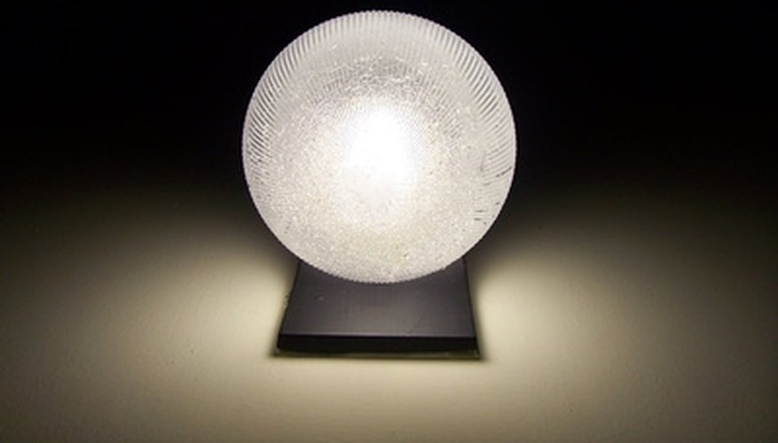 Photo Credit: Light Bulb image by Sujit Mahapatra from <a href='http://www.fotolia.com'>Fotolia.com</a> Understand foot-candles and lumens.
