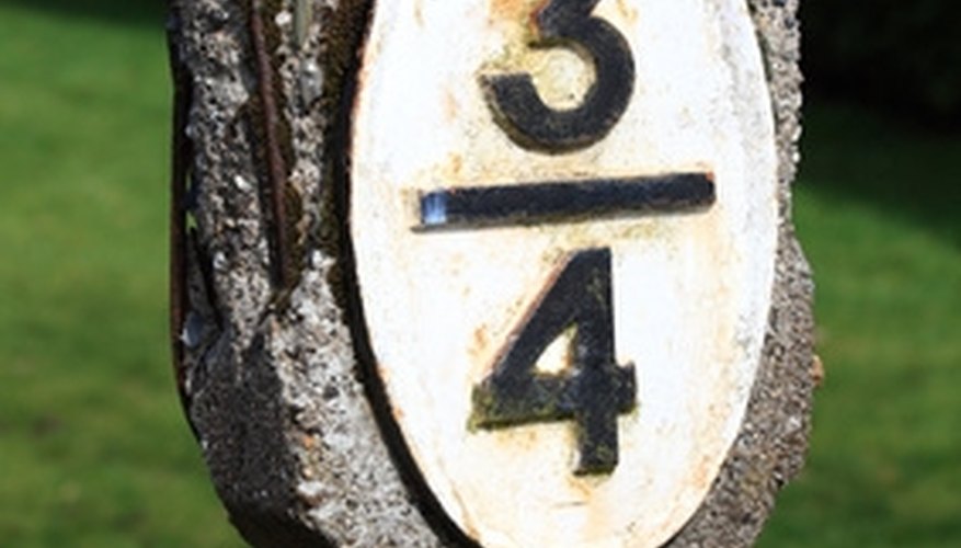 Photo Credit: Vintage railway distance sign or marker image by pablosphotos from <a href='http://www.fotolia.com'>Fotolia.com</a> A fraction has two parts.