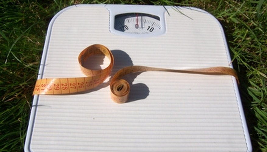 Photo Credit: libra image by Mitarart from <a href='http://www.fotolia.com'>Fotolia.com</a> You can calculate mass from weight, using a simple bathroom scale.