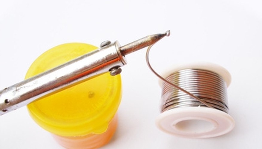 Photo Credit: soldering image by Bube from <a href='http://www.fotolia.com'>Fotolia.com</a> A bit of judiciously applied solder is helpful when making a magnetic switch.