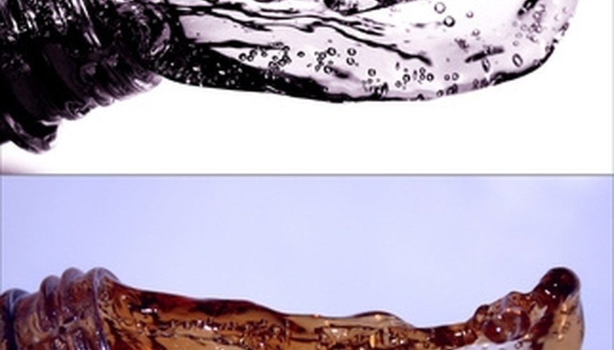 Photo Credit: water splash - bottle and water in a moment image by Stasys Eidiejus from <a href='http://www.fotolia.com'>Fotolia.com</a> Water weight can be easily converted to gallons, since its density is known.