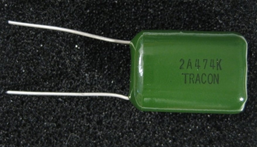 Photo Credit: capacitor image by Albert Lozano from <a href='http://www.fotolia.com'>Fotolia.com</a> Capacitors come in many forms and can be composed of many different materials.