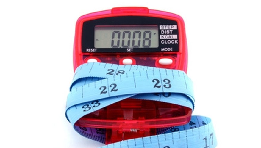 Photo Credit: pedometer with tape measure image by Andrew Brown from <a href='http://www.fotolia.com'>Fotolia.com</a> Meters and miles can be converted to feet.