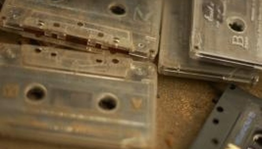 Photo Credit: Jupiterimages/Photos.com/Getty Images Old cassettes used magnetic tape to store audio for playback.