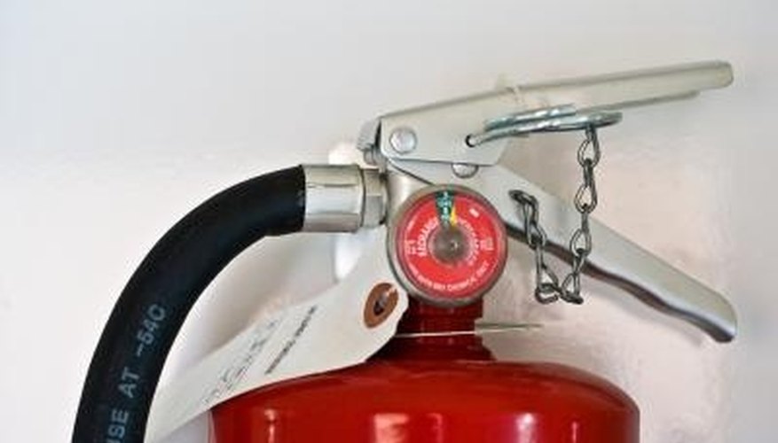 Photo Credit: Jupiterimages/Photos.com/Getty Images Fire extinguishers have gauges that indicate the charge level.