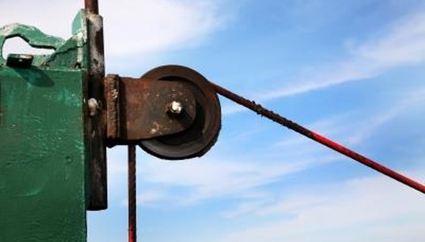 Photo Credit: Jupiterimages/Photos.com/Getty Images A pulley is a simple machine that makes lifting easier.