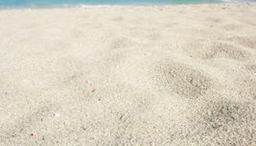 Photo Credit: Jupiterimages/Photos.com/Getty Images Sand on the beach looks very different from sand under a microscope.