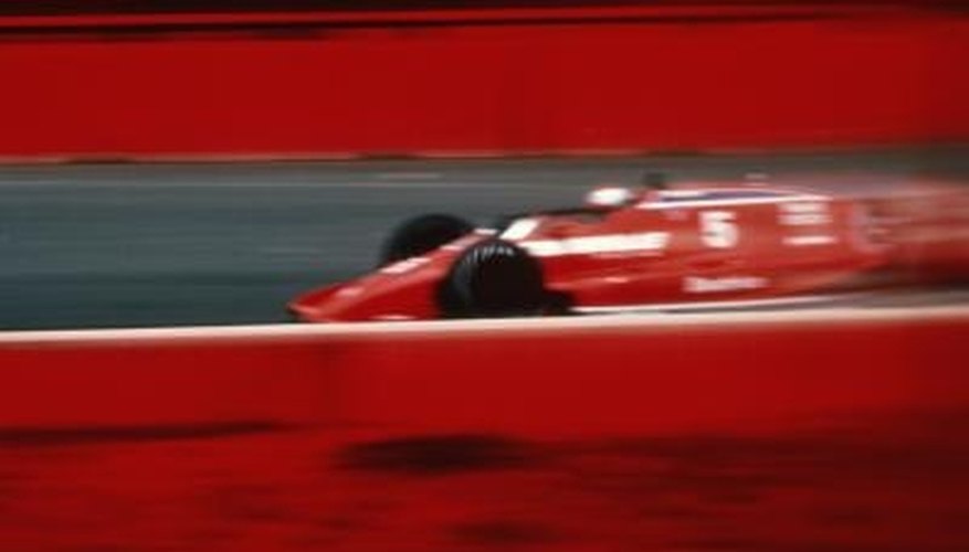 Photo Credit: Jupiterimages/Photos.com/Getty Images A moving race car has both kinetic and potential energy.
