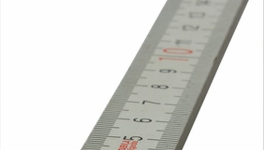 Photo Credit: ruler image by Oleg Kapustin from <a href='http://www.fotolia.com'>Fotolia.com</a> Read a Ruler Measurement