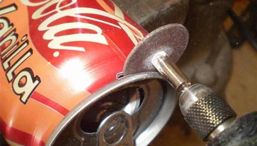 The Dremel is delicate enough to keep the can from crushing during cutting. The Dremel is delicate enough to keep the can from crushing during cutting.