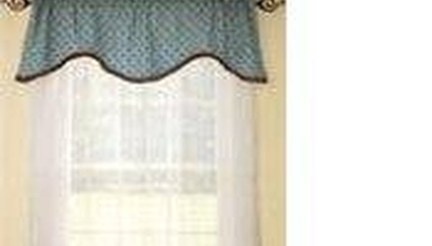 A shaped valance over sheer curtains. A shaped valance over sheer curtains.