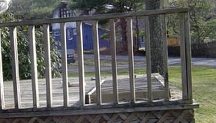 A simple, standard deck railing made from inexpensive wood pickets A simple, standard deck railing made from inexpensive wood pickets