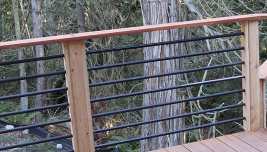 Metal bars fitted into a pre-drilled wood frame Metal bars fitted into a pre-drilled wood frame