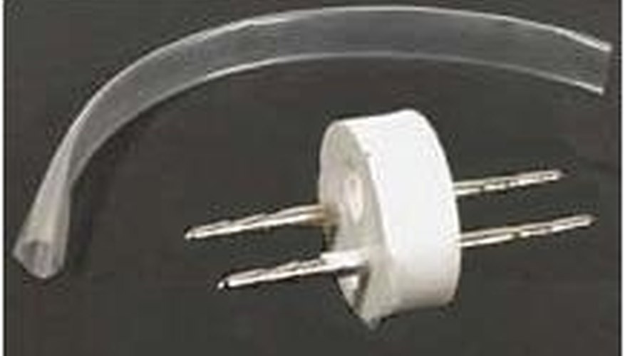 Clear plastic tubing and a splice connector. Clear plastic tubing and a splice connector.
