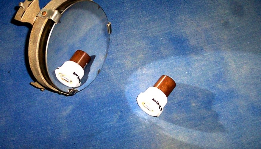 The mirror mount (cell) is adjustable and screws to the tube.