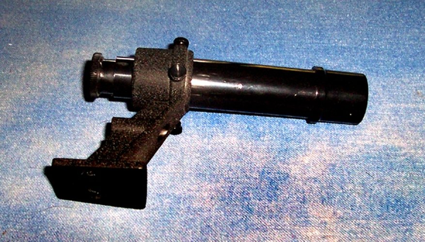 The finder scope assembly simply screws to the tube.