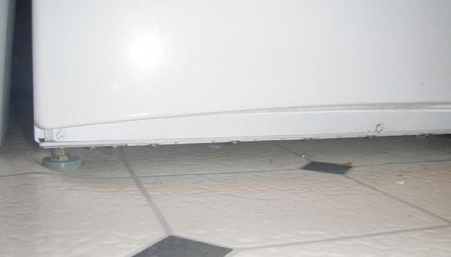 Remove lower front cover by removing 3 screws holding it on bottom. Remove lower front cover by removing 3 screws holding it on bottom.