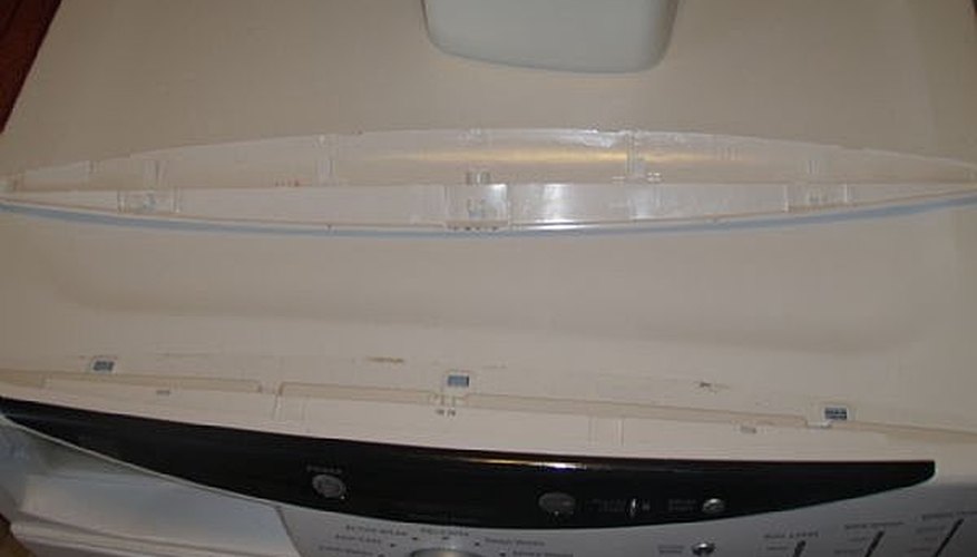 Remove screws connecting top control panel to front of washer. Remove screws connecting top control panel to front of washer.