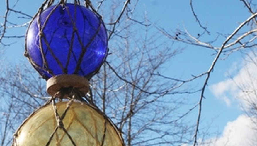 Gazing balls can hang from wrapped metal. Gazing balls can hang from wrapped metal.
