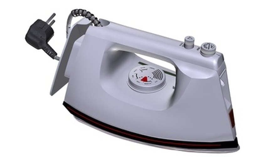 Use a dry, cotton setting for applying iron-on mending fabric. Use a dry, cotton setting for applying iron-on mending fabric.